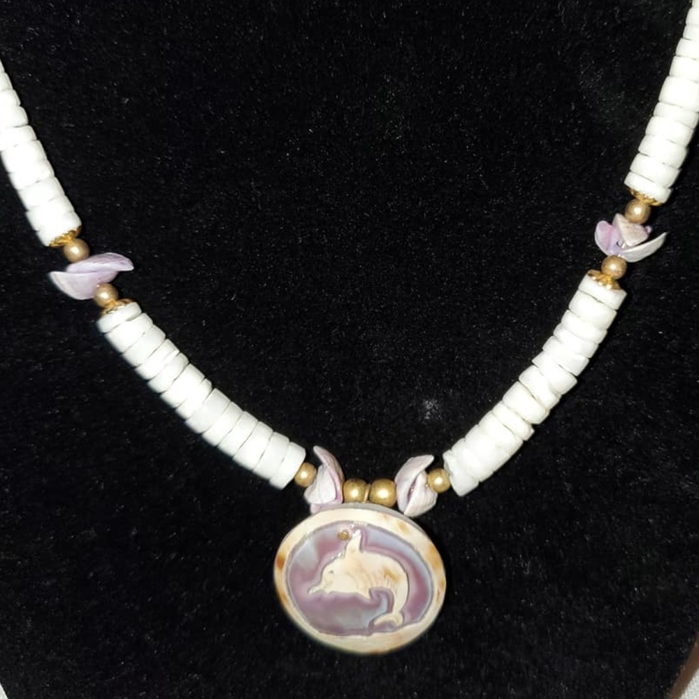 Carved dolphin Hawaiian shell necklace